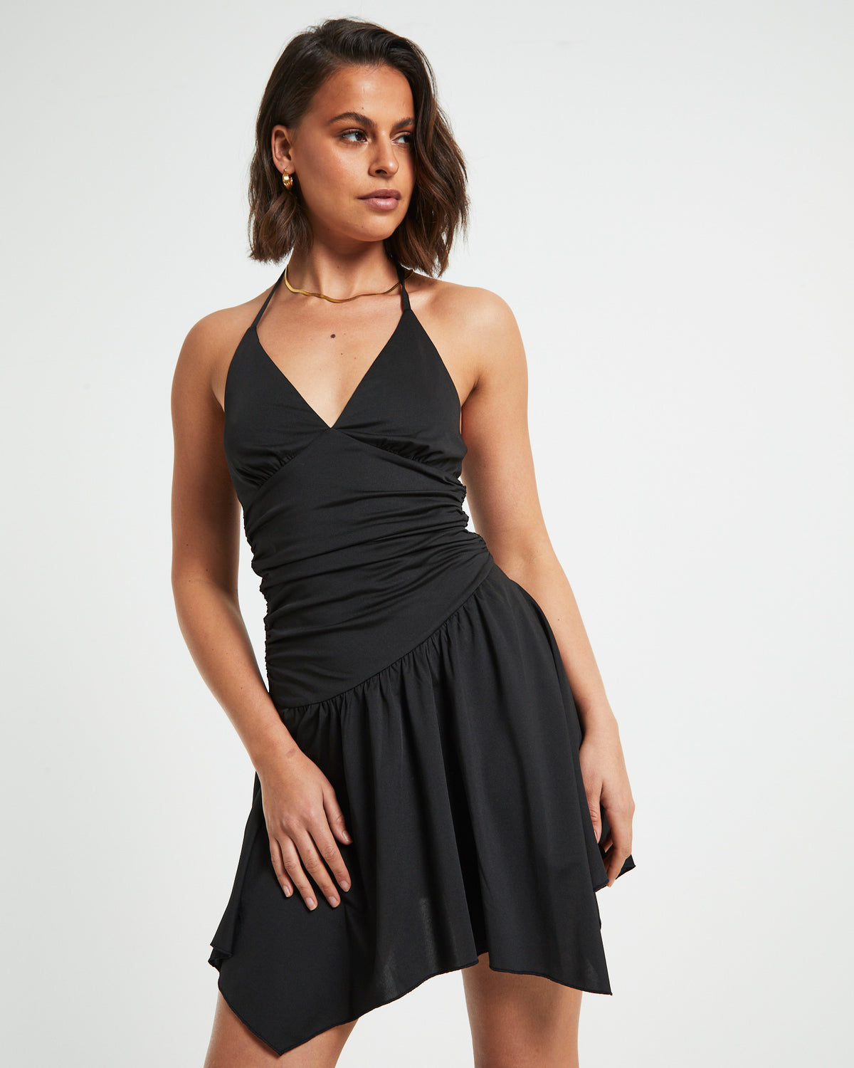 Sawyer Asymetric Hem Halter Mini Dress in Black BLACK